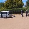 Hilarious moment Macron's delegation speeds away from Windsor Castle with the boot still open sending luggage flying out the back - after his wife rejected him on the steps his airplane