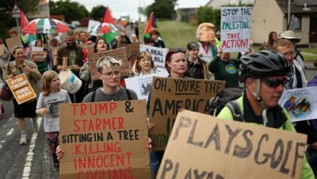 Donald Trump protestors led in chants against US president as they gather near his Scots golf course