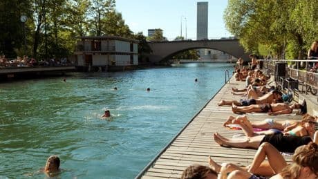 The Swiss city where commuters swim from work is perfect for a heatwave summer