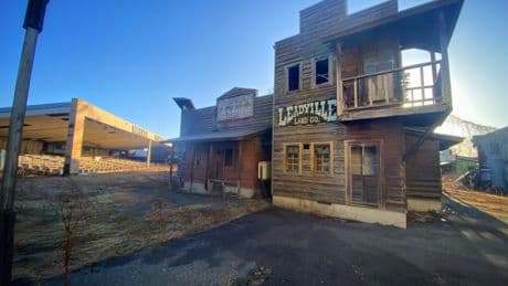 Inside haunting theme park left abandoned for 18 years with empty stadium and decaying Ferris wheel