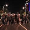 Tensions soar in Serbia as angry protesters clash with police, set fire to party offices