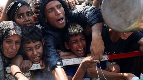 Starmer says UK to help air drop aid into Gaza - but UN warns they could kill starving civilians