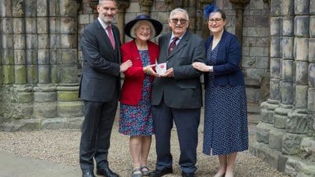 Lanark historian collects MBE from King Charles