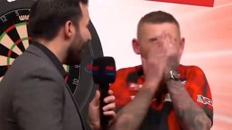 Darts host forced to apologise after Nathan Aspinall’s X-rated interview with Asp left covering his face in horror