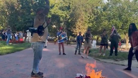 Military veteran detained after burning American flag in protest at Trump’s executive order