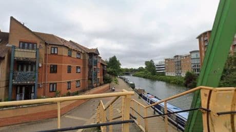 Manhunt launched for alleged killer after man found dead on canalside bench