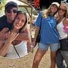 Zara McDermott gets the family seal of approval as she cuddles up with boyfriend Louis Tomlinson's sister Lottie at Glastonbury