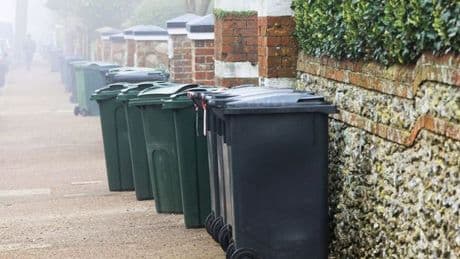 Simple and cheap hack to keep bins from blowing away as first storm of season is forecast