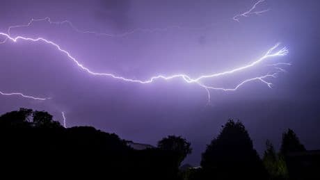 UK hit by 30,000 lightning strikes and flash flooding – when will sun return?