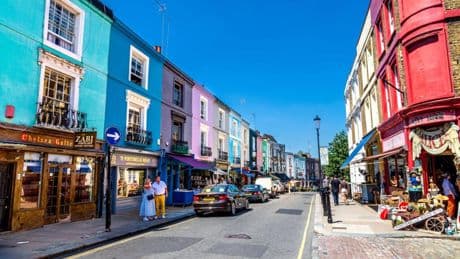 Fed-up millionaires paint iconic colourful homes BLACK to put off crowds of influencers posing outside on their doorstep