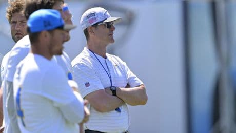 Jim Harbaugh gives advice after foul ball misses his brother Jim, Ripken at Orioles game
