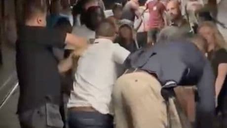 Horror moment brawl breaks out in tube station with small kids stuck in middle