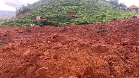 A landslide buries homes outside Guinea's capital, killing 11 and injuring 10