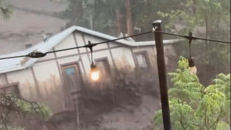 Three missing and house swept away as flash flooding hits New Mexico