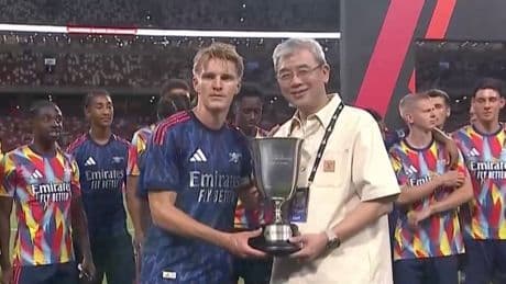 Arsenal stars look baffled as Martin Odegaard is presented with trophy he doesn’t even bother to lift