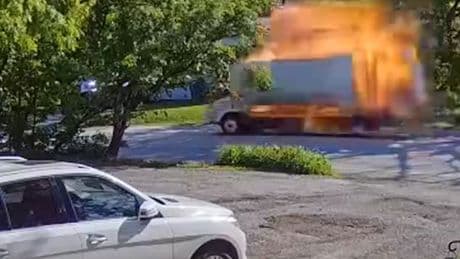 Moment truck explodes while driving through residential neighbourhood