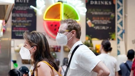 Covid surge hits California as officials urge people to start wearing masks again