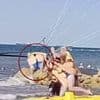 Horrifying moment female tourist is 'knocked out cold' during parasailing launch and carried into the air unconscious after 'cable struck her on the head'