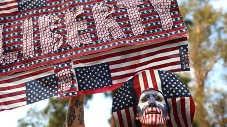 ‘Workers over billionaires’: Thousands take to the streets at anti-Trump rallies across the country
