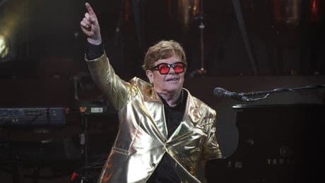Elton John says ‘we will not back down’ in awards speech addressing AI concerns
