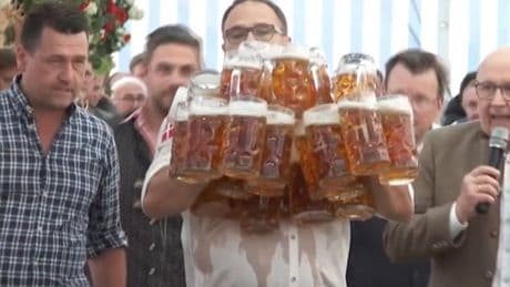 Pints go flying as waiter attempts to carry 31 beers in world record attempt