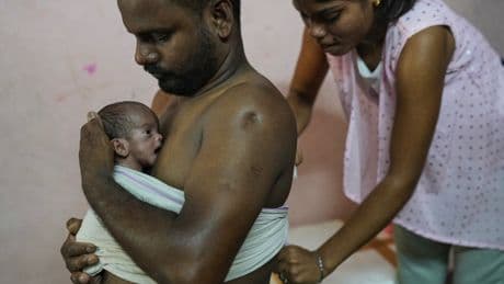 Photos show newborn caregiving programs helping ease parenting in India