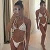 Rebekah Vardy shows off her toned physique in a tiny white bikini during family holiday