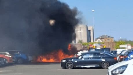 Massive fire engulfs multiple cars outside major UK shopping centre as plume of black smoke billows into sky