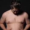Couch potato turns into body-builder in one year with punishing gym regime... it's not just his body that's transformed
