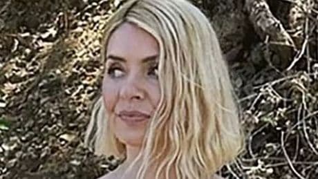 Holly Willoughby lets her hair down in white swimsuit on sun soaked holiday