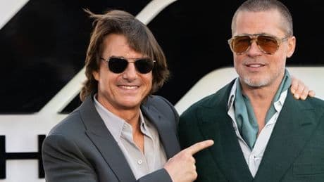 Brad Pitt rocks a bold green suit as he embraces Tom Cruise at F1 The Movie premiere