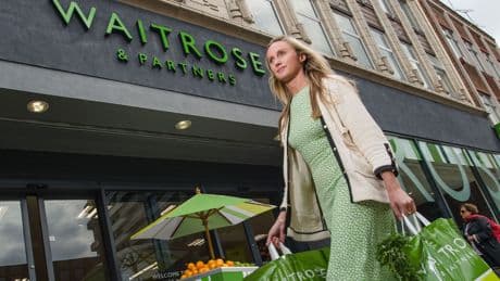 John Lewis blames budget tax hikes for deeper loss