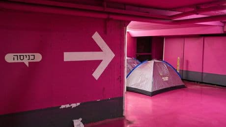 Photos of Israel's underground parking lots and subways became bomb shelters amid war with Iran