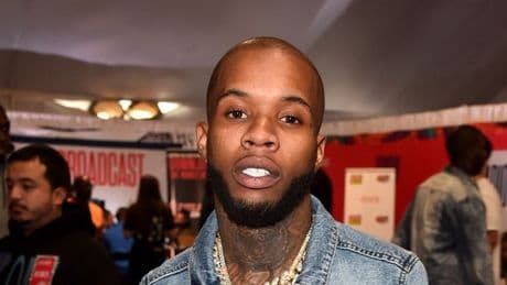 Tory Lanez soaked in blood as he's pictured after being stabbed 14 times in prison