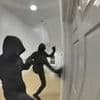 Terrifying moment balaclava-clad thugs try to smash way through family's front door after they reported antisocial behaviour