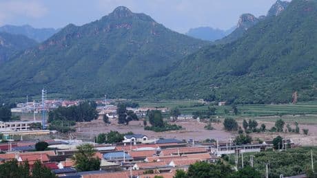 Heavy rain causes flooding, evacuations and at least 38 deaths around Beijing region