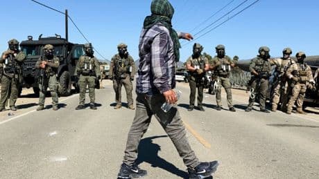 Protesters and federal agents clash during raid at Southern California farm