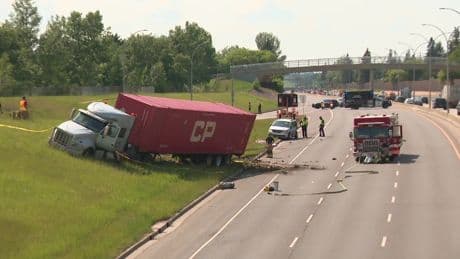 Woman checking van struck and killed by semi on Whitemud Drive, child survives