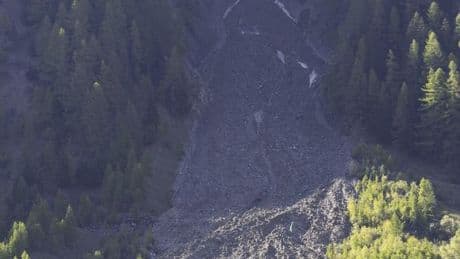 As a landslide threatens an Alpine village, Swiss authorities expand the evacuation order
