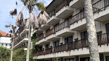 Abandoned hotel where beds made and food is still on tables