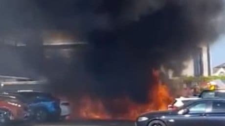 Cars catch fire at London shopping centre with smoke pouring into the sky