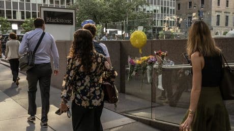 'A new normal': Office life goes on after mass shooting rattles New York City