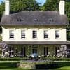 Villagers force travel firm who rebranded Welsh manor with an English name to revert back to its original title