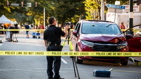 Minivan ploughs into Labor Day festival crowd leaving boy fighting for life