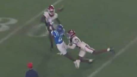 Arkansas football star Kani Walker taken to hospital after knee to the head leaves him motionless on turf