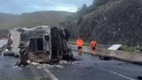 Lorry overturns and bursts into flames on busy motorway sparking rush hour delays