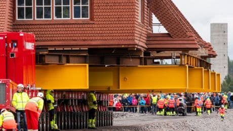 An entire wooden church is being moved across a city – this is why