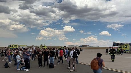 Passengers Evacuate Smoky American Airlines Plane at Denver Airport