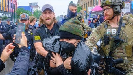 Federal officers in tactical gear went into a Latino community in Minneapolis. A protest followed