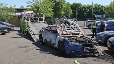 Burnt out Audi at centre of Daniel attack at garage in pictures as cops hunt men